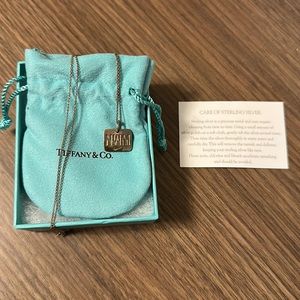 Tiffany & Co. Nike Women’s Marathon sterling silver necklace.